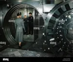 1940s-1950s-woman-walking-into-private-bank-vault-bank-teller-and-erc9fg.jpg 1940s-1950s-woman-walking-into-private-bank-vault-bank-teller-and-erc9fg.jpg